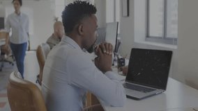 Developer sitting at open‑plan office, studying glowing NFT graphic with blockchain code overlay. Technology, innovation, collaboration, workstation, digital, modern, workspace - Powered by Shutterstock - Get 15% off with code: PIKWIZARD15