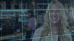 blonde woman standing at counter in retail pharmacy, displaying teal grid overlay with shelves. Healthcare, retail, technology, professionalism, frontline, service, modern - Powered by Shutterstock - Get 15% off with code: PIKWIZARD15