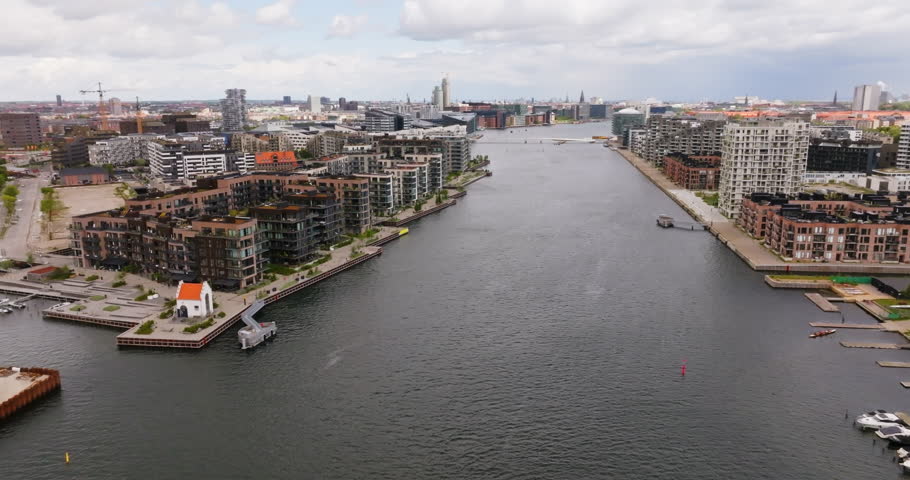 Aerial view rotating in front of riverside, luxury condos in Copenhagen, Denmark