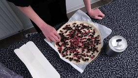 Preparing a mixed berry tart: handson culinary experience with fresh fruits. - Powered by Shutterstock - Get 15% off with code: PIKWIZARD15
