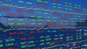 Displaying financial overlay on dusk cityscape, showing stock tickers, yellow trend lines. Finance, urban, data visualization, technology, investment, analytics, modern - Powered by Shutterstock - Get 15% off with code: PIKWIZARD15