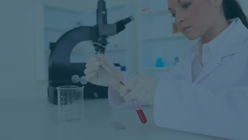 female scientist pipetting red liquid onto slide in laboratory, featuring floating gold confetti. Scientist, laboratory, research, precision, innovation, scientific, professional