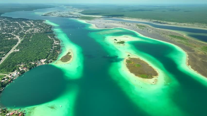Lagoon of seven colours in Balacar, Cenote Esmeralda turquoise lake water, Panoramic drone view