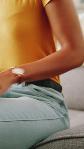 Back pain, hands and posture with person on sofa in living room of home for injury or massage. Accident, muscle fatigue and spine with woman closeup in apartment for inflammation or physical recovery