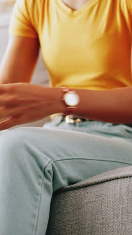 Cramp, hands and stomach pain with person on sofa in living room of home for ibs or indigestion. Condition, discomfort and tender tummy with woman closeup in apartment for abdominal inflammation