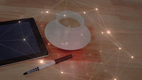 Tablet sitting angled on 3D wooden desk, coffee cup waiting beside pen, network lines glowing. Technology, workspace, modern, digital, connectivity, professional, minimalist - Powered by Shutterstock - Get 15% off with code: PIKWIZARD15