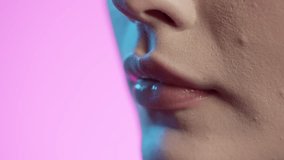 woman eating white grapes in close-up, girly nail polish and red lipstick lips on pink background - Powered by Shutterstock - Get 15% off with code: PIKWIZARD15