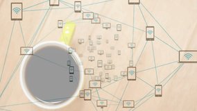 Coffee cup sitting on wooden desk while teal network icons connecting smartphones tablets laptops. Minimalist, digital connectivity, workspace, technology, abstract, network, modern - Powered by Shutterstock - Get 15% off with code: PIKWIZARD15