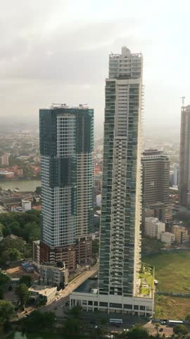 Cinematic drone reveal showcasing Altair and Lotus Towers in Colombo, Sri Lanka with scenic views of Beira Lake - perfect for real estate, architecture, and investment promo use.