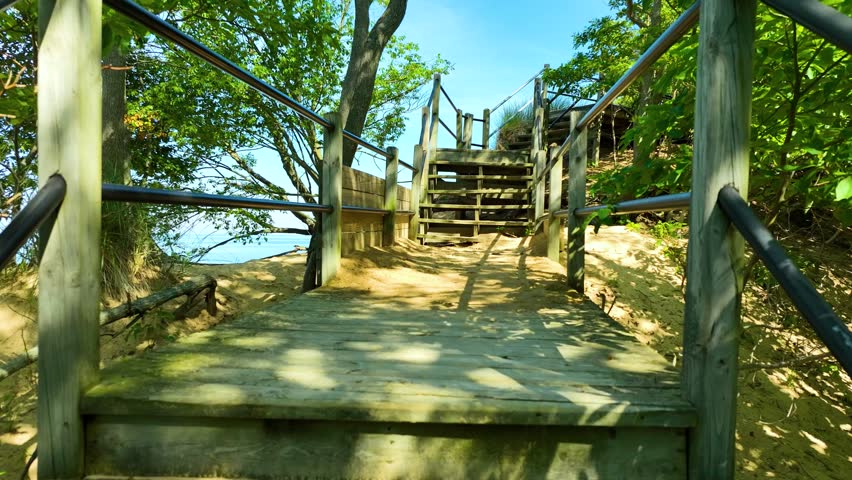Positioning a drone over a walkway for a shot.
