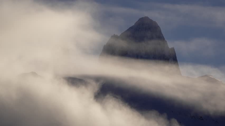 Epic timelapse of Mount Fitz Roy summit with clouds in Patagonia, Argentina. Static camera view