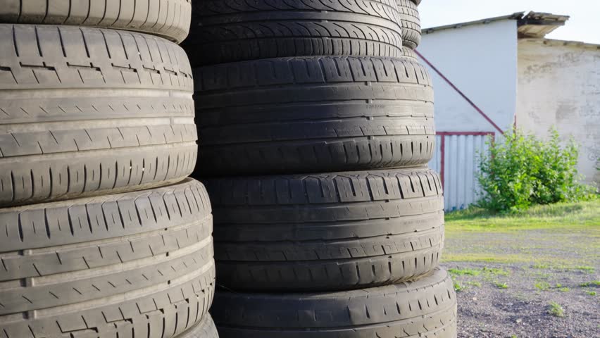 Pile of old used car tires. Close up