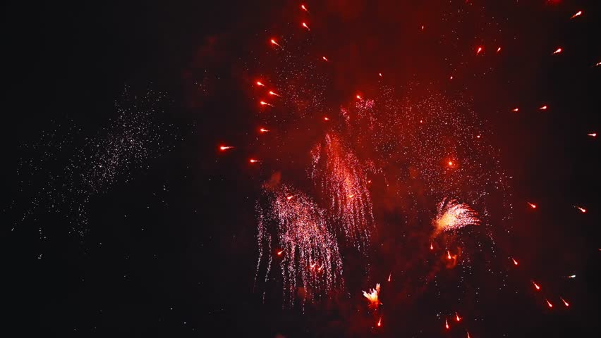 bright colorful festive fireworks for New Year's Eve celebrations on the background of the night sky