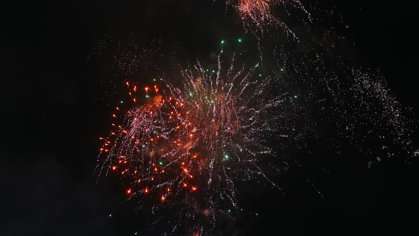 big colorful festive fireworks display at celebration of pyrotechnic show in the night sky