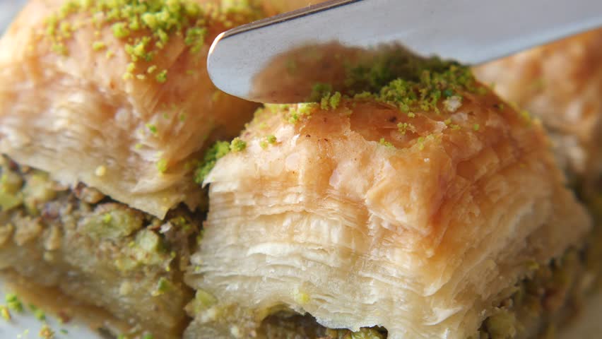 Delicious baklava preparation with layers of pastry and nuts
