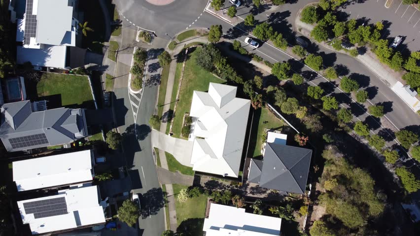 Aerial view of a suburban roundabout in Australia with trucks and cars