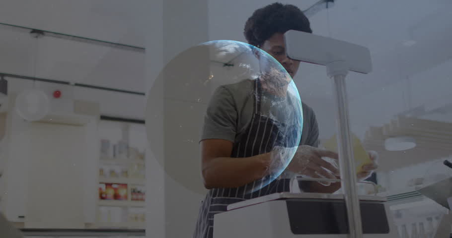 Warehouse employee packing box in fulfillment center, overlaying candlestick charts and globe. Logistics, automation, efficiency, productivity, industrial, technology, commerce