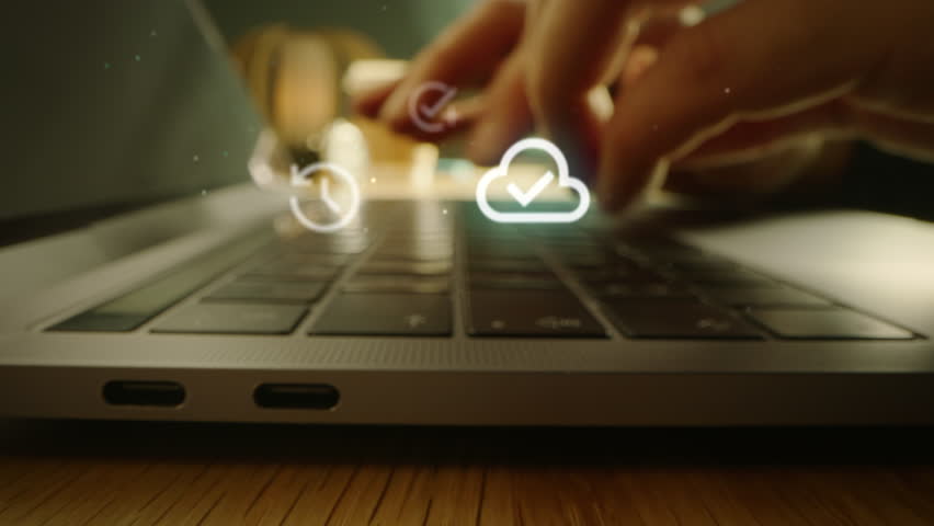 Detailed Shot with Person Working on Laptop Computer. Hands Press the Keys. Visualization Shows Digital Icons for Diverse Features: Safety, Web, Messenger, Remote Storage and Other Internet Resources