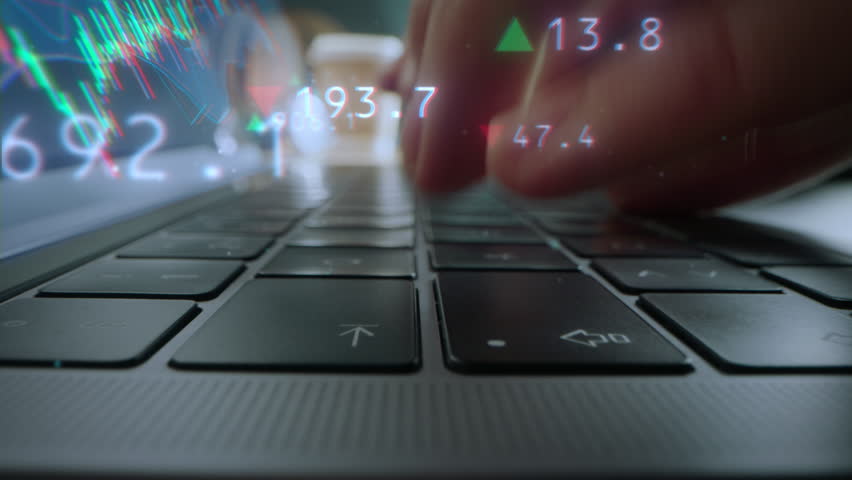 Close Up on Person's Hands Typing on Keyboard, Using Laptop Computer. Animated Visualizations with Positive and Negative Stock Market Tokens. Stock Exchange, Finance and Investing Theme