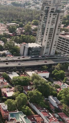 Slow-motion vertical view of traffic on highways in Mexico City