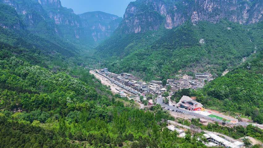 Aerial shot of the small Huixian community within the valley in Henan Province, China. Small town near the famous Guoliang Tunnel.