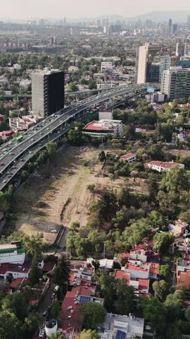 Slow motion aerial view of a highway in Mexico City, vertical video