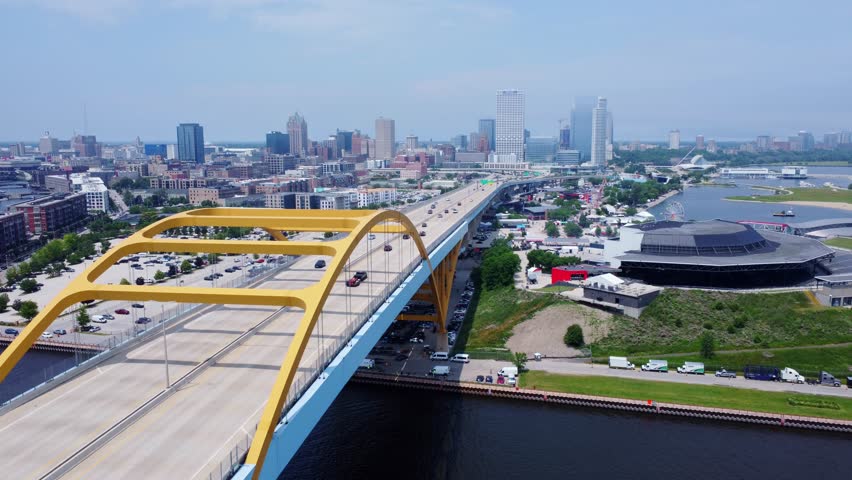 Downtown Milwaukee, Wisconsin; 4K Aerial (Establishing Shot) Revealing The Metropolitan City From Over The Iconic Hoan Memorial Bridge.