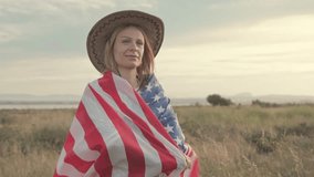 Confident blonde woman in cowboy hat waving american flag amid golden wheat field at sunset, embodying national pride and freedom.Usa celebrate 4th of july. Independence day concept - Powered by Shutterstock - Get 15% off with code: PIKWIZARD15