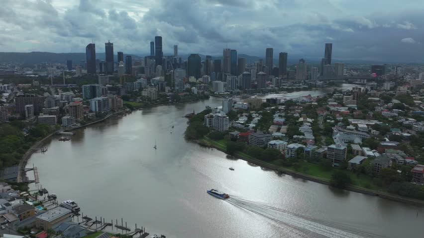 Brissy Brisbane City River Quay Citycat ferry boats Australia aerial drone South Bank Park Skyline skyscraper cranes morning sun rainy clouds Aussie summer autumn winter static shot
