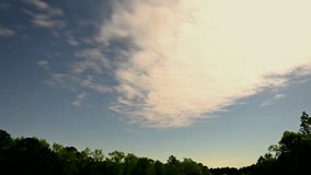 Clouds covering sky with stars at night, time lapse, Mt. Gilead, North Carolina, USA. The night of the most distant full Moon (Pink Moon) of 2025. - Powered by Shutterstock - Get 15% off with code: PIKWIZARD15