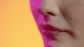 woman eating a crispy waffle in close-up, girly nail polish and red lipstick lips on green background - Powered by Shutterstock - Get 15% off with code: PIKWIZARD15