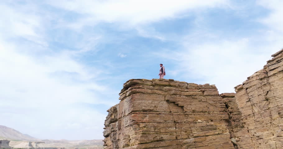 Man On Top Of Cliff At Band-e Amir National Park In Afghanistan - Drone Shot