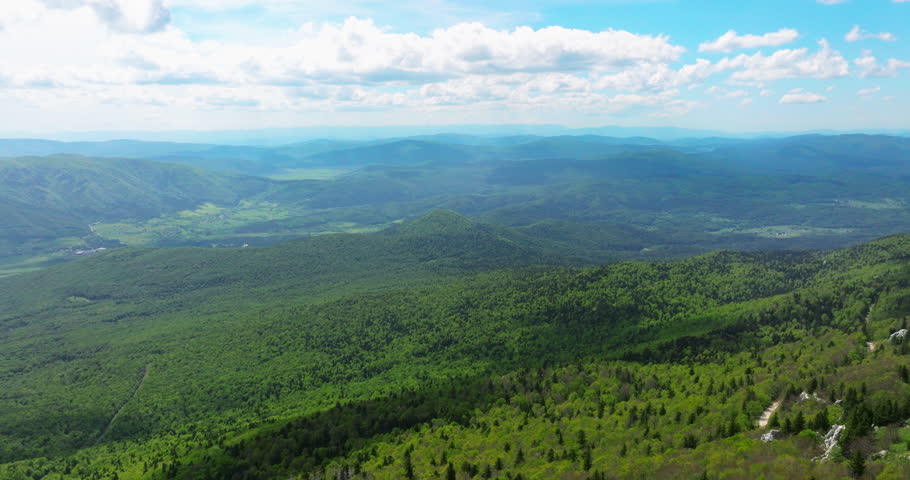 Man On Stage-like Rock Formation On Pljesevica Mountain In Croatia. drone pullback reveal