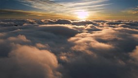 Flight above soft morning clouds at golden sunrise in dreamy aerial landscape - Powered by Shutterstock - Get 15% off with code: PIKWIZARD15