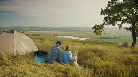 Pet-Inclusive Family Time. Senior Man Sits With His Family and Dog by a Tent, Admiring the Beautiful Landscape. A Peaceful Moment of Togetherness, Nature, and Joyful Living With a Beloved Pet - Powered by Shutterstock - Get 15% off with code: PIKWIZARD15