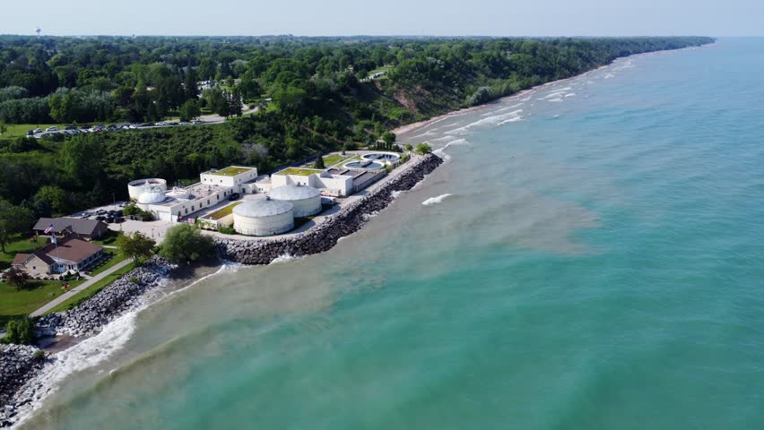 Water Treatment Plant Along The Coast Of Port Washington, Wisconsin; 4K Aerial Birds Eye View (Flyover).
