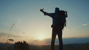 Spiritual Joy, Faith in Nature, Grateful Living. Senior Man With Backpack Stands on a Mountain Peak at Sunset With Raised Arms, Praising God in a Powerful Moment of Worship and Awe in Nature - Powered by Shutterstock - Get 15% off with code: PIKWIZARD15