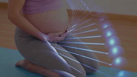 Pregnant woman practicing prenatal exercise indoors, displaying glowing molecular DNA model overlay. Maternity, wellness, science, health, tranquility, modern, biology - Powered by Shutterstock - Get 15% off with code: PIKWIZARD15