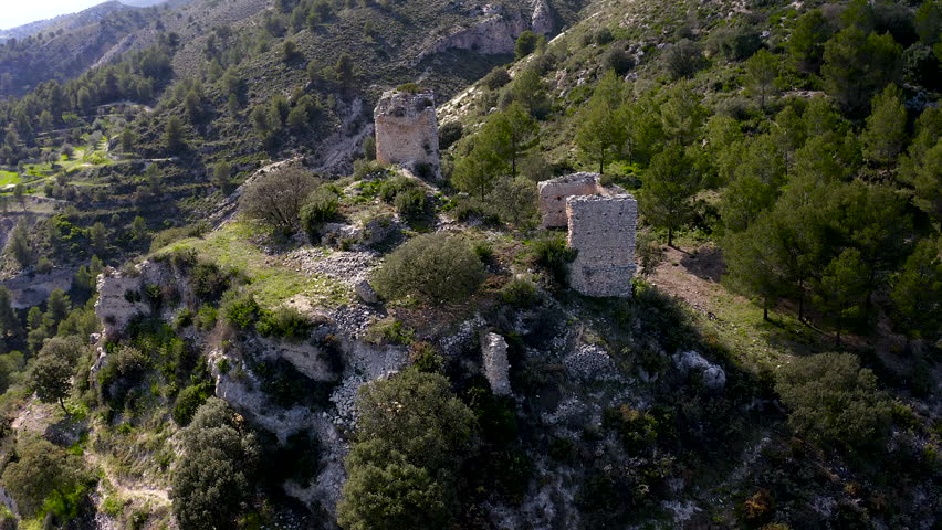 Aerial view of the ruins of Costurera Castle on a peak, chronologically located in Balones in the middle of the 12th century, in the interior of the province of Alicante, Spain.