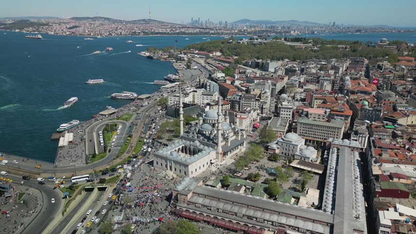 Drone descends toward Suleymaniye Mosque, showcasing its grand domes. Behind it, Istanbul