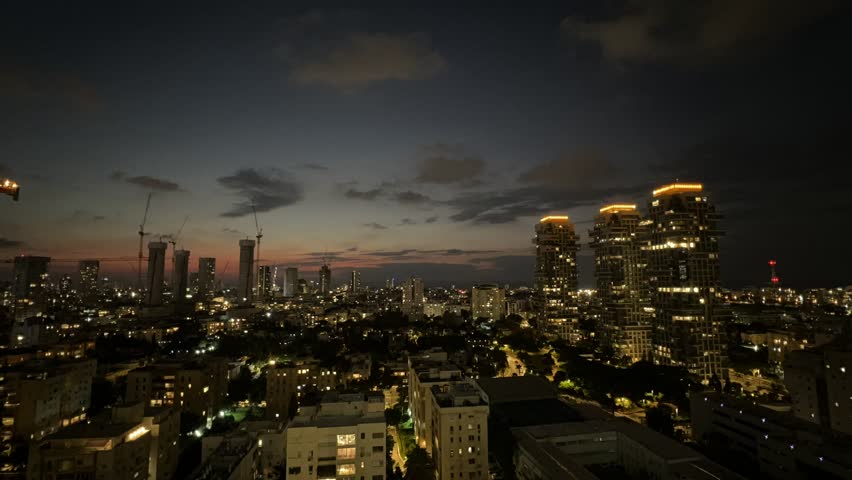 Timelapse video in Tel Aviv city on fast moving clouds