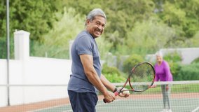 senior couple playing tennis on court, showing health data with heart icon and performance graph. Outdoor, activity, vibrant, fitness, recreation, healthy, active - Powered by Shutterstock - Get 15% off with code: PIKWIZARD15