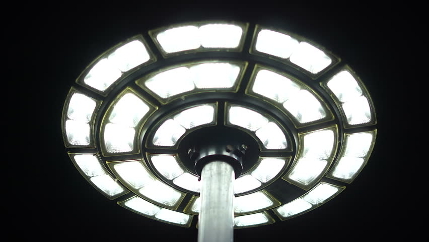 Solar powered round lamp that provides light at night.