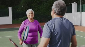 senior couple playing tennis outdoors, highlighting animated health graph, court lines, rackets. Athletic, recreation, vibrant, fitness, outdoor, companionship, leisure - Powered by Shutterstock - Get 15% off with code: PIKWIZARD15