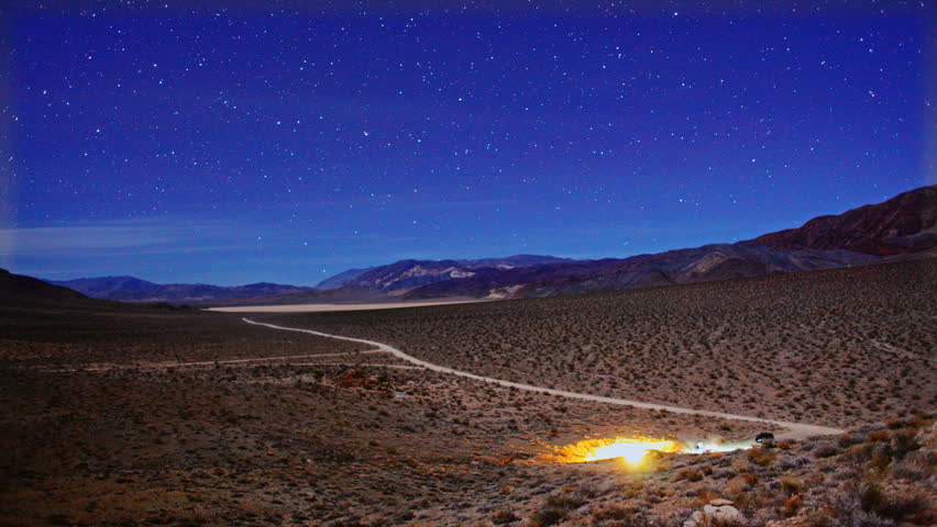 Epic Star Trails Night Sky Timelapse over Death Valley National Park Desert in California.