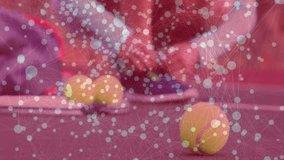 Woman kneeling on red tennis court gathering yellow balls, showing sports technology data overlay. Athletic, digital, futuristic, sports, innovation, fitness, abstract - Powered by Shutterstock - Get 15% off with code: PIKWIZARD15