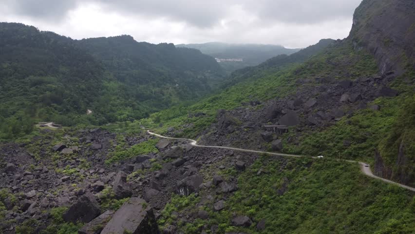 A car is driving in a landslide area