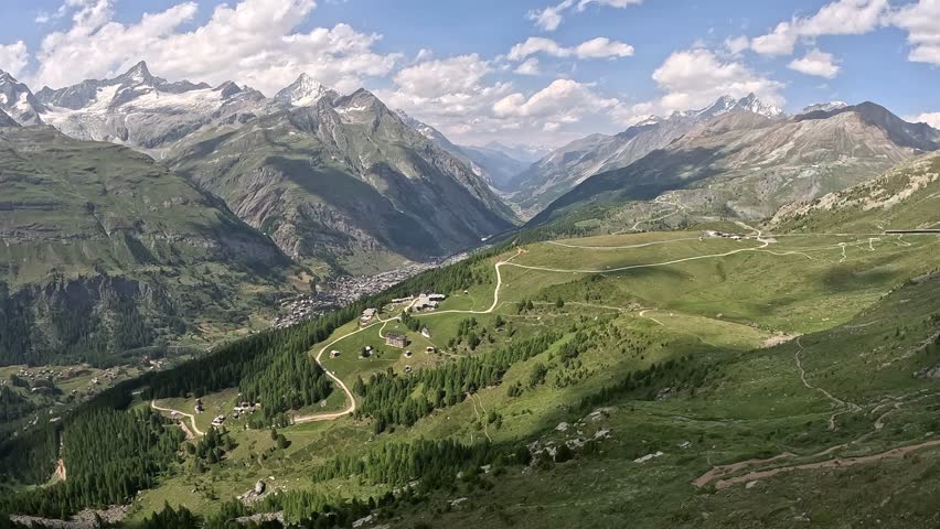Cable car ride towards zermatt town in the valley at Swiss Alps in Switzerland, Europe