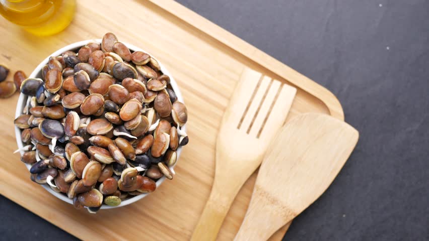 Roasting pumpkin seeds in a cozy kitchen setting