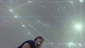 Man raising tennis racket indoors, showcasing glowing network lines and lens flares for tech theme. Athlete, sports, digital, futuristic, technology, motion, energy - Powered by Shutterstock - Get 15% off with code: PIKWIZARD15